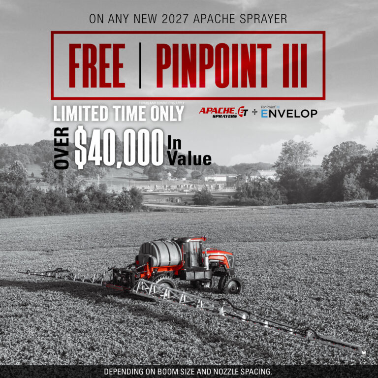 sprayer with booms extended in bean field